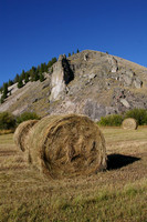 Hay bales and cliff