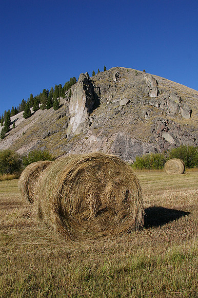 Hay bales and cliff